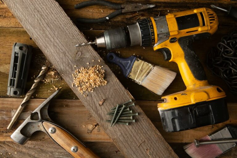 Resident compares a dripping pipe with repair tools and a maintenance checklist in a home utility area.