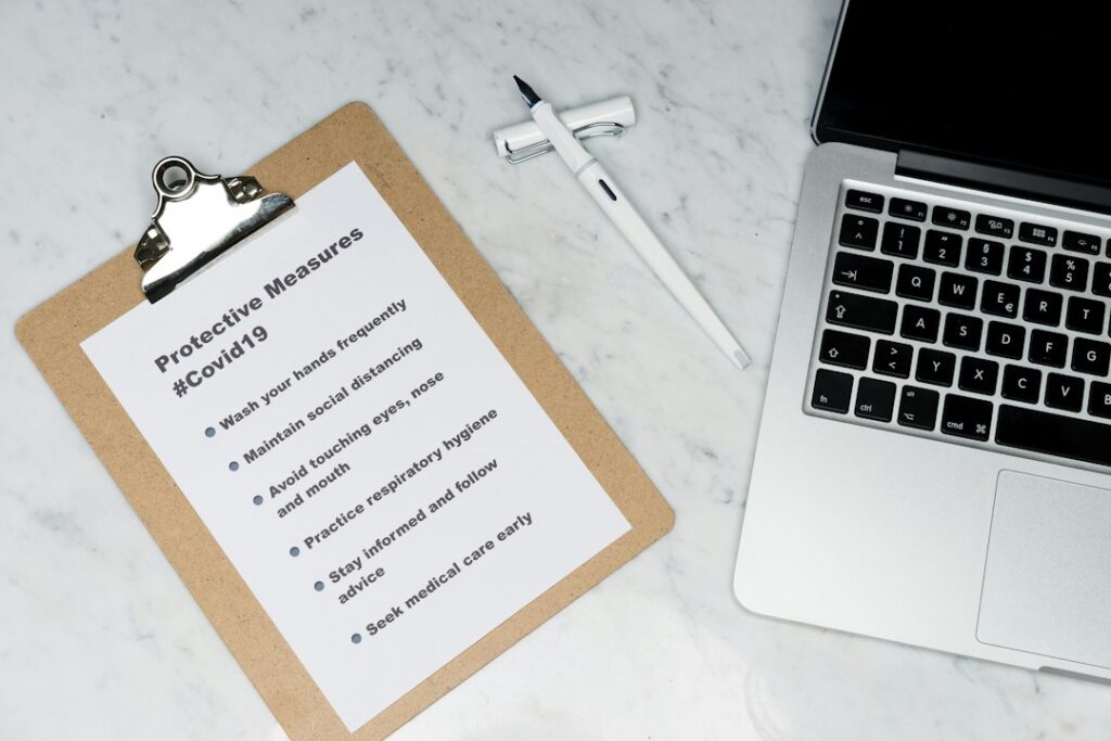 Tenant and landlord reviewing a lease beside keys, a move-in checklist, and a rental home inspection folder.